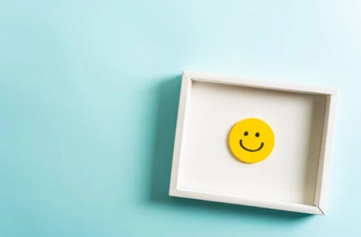 Framed yellow smiley face icon