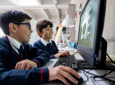 Two boys using a computer