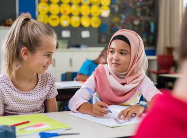 Two girls in a classroom